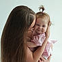 Emiliya is registered to the contest to win money with this photo: baby, child, woman, mother, hug, smile, hair, long_hair, ponytail, pink_clothing, dress, portrait, love, affection, holding, cuddle, indoor, human, skin, person