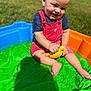 Ezekiel is registered to the contest to win money with this photo: baby, barefoot, blue_shirt, child, cute, grass, happy, outdoor, plastic_pool, play, pool, red_overalls, shadow, smiling, summer, sunlight, toddler, toy, water_toy, yellow_turtle