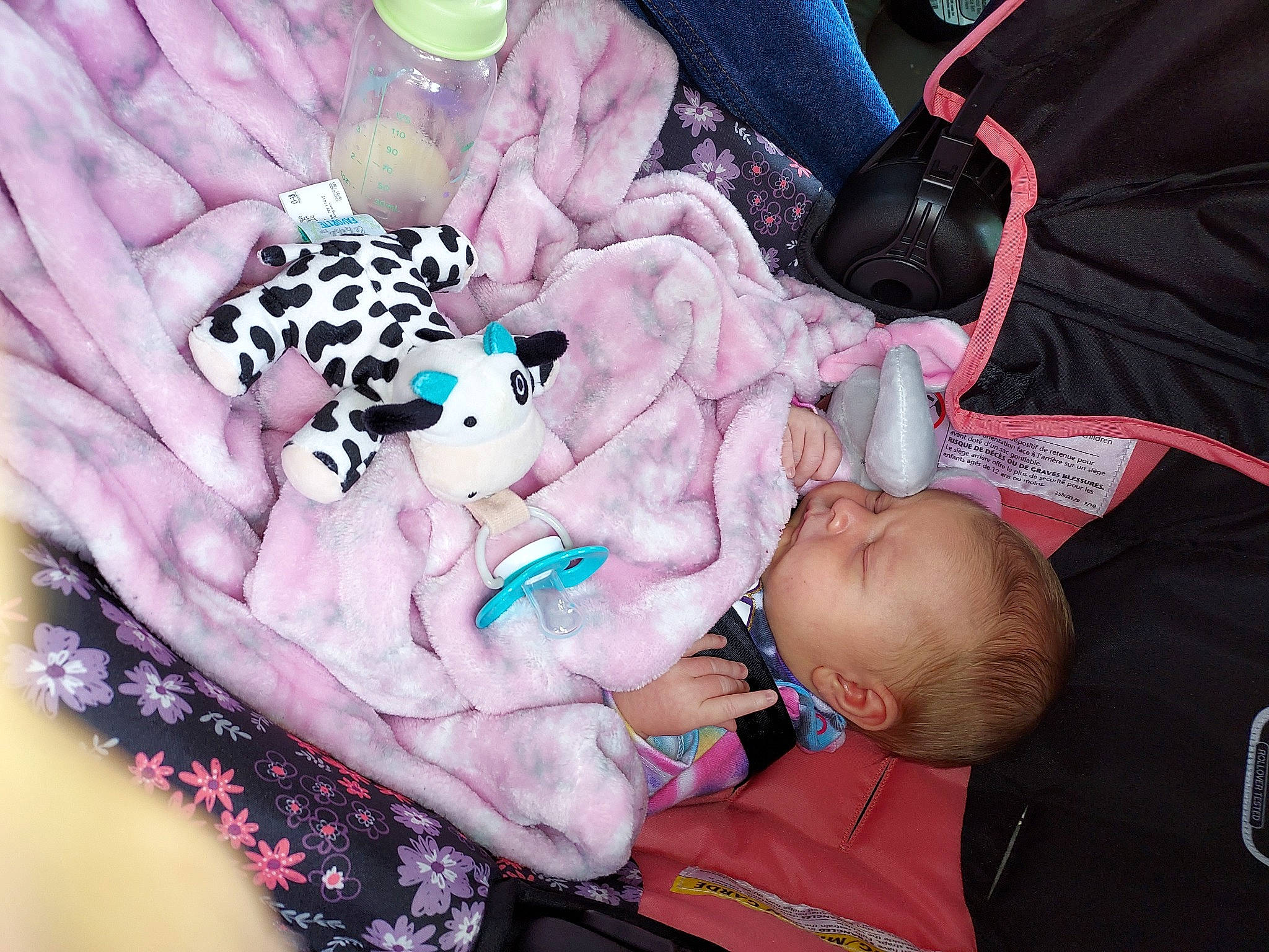 Brinley is registered to the contest to win money with this photo: baby, baby_products, baby_toddler_clothing, child, comfort, finger, flesh, hand, happy, linens, magenta, nail, pattern, person, petal, pink, skin, sleep, stuffed_toy, toddler