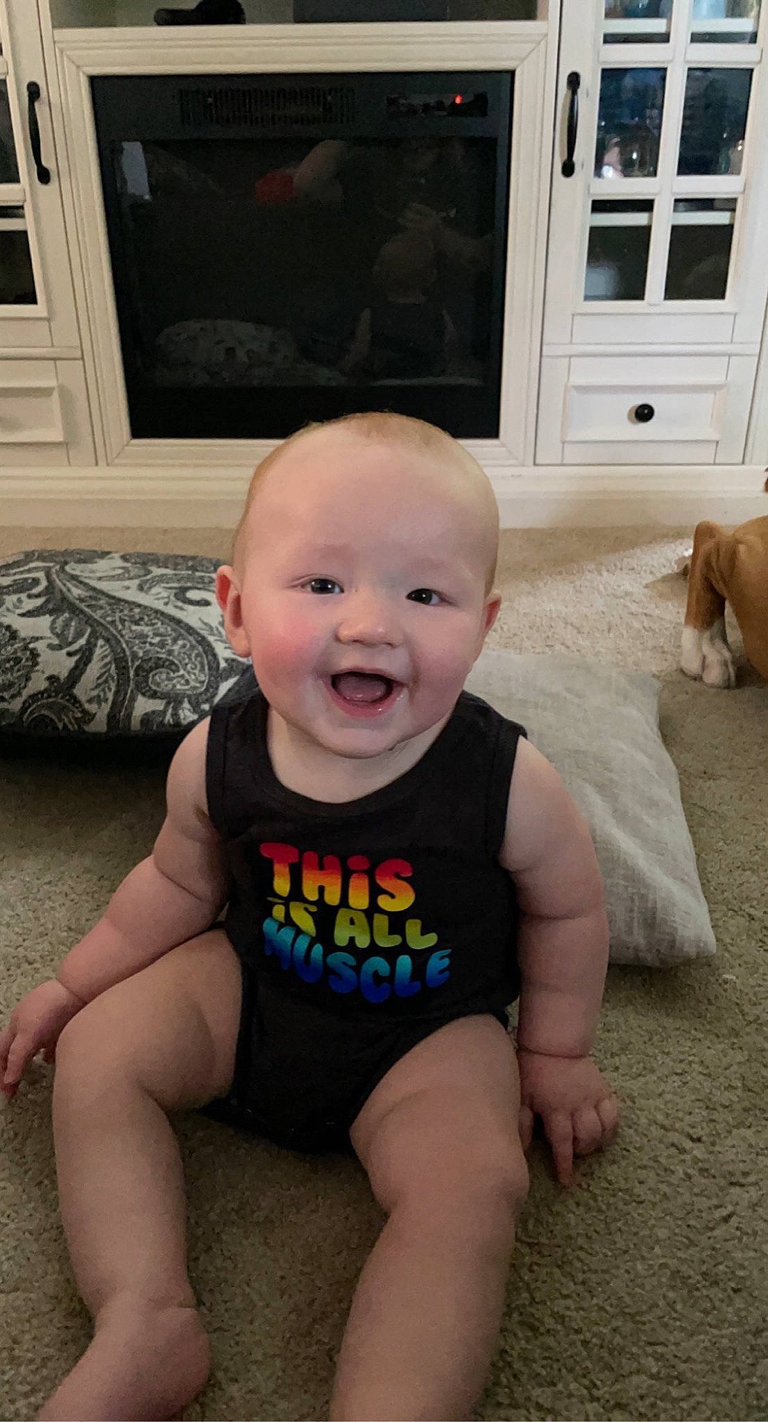 Eli is registered to the contest to win money with this photo: baby, baby_toddler_clothing, cheek, eye, floor, flooring, hairstyle, happy, iris, joint, joy, leg, person, photograph, skin, smile, standing, t_shirt, thigh, toddler