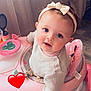 baby, child, infant, pink, headband, bow, walker, indoor, curtains, floor, toy, face, blue_eyes, sitting, cute, clothing, person, smiling, heart_emoji, playful