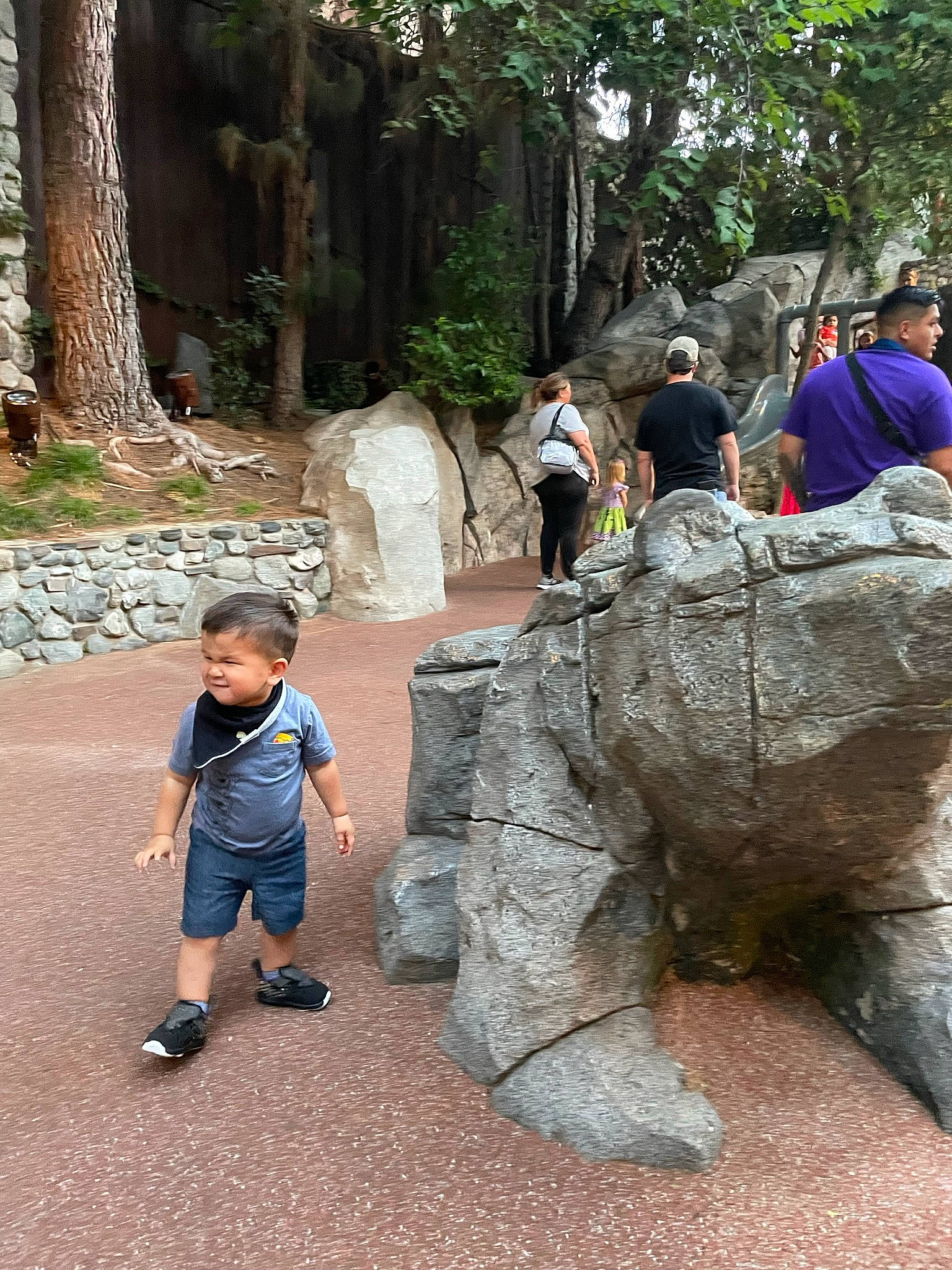 Clark is registered to the contest to win money with this photo: art, bedrock, botany, font, leisure, mammal, outcrop, person, plant, recreation, rock, sculpture, shorts, statue, t_shirt, temple, toddler, tourism, tree, vacation