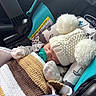 baby, car_seat, knitted_hat, pom_poms, blanket, pacifier, sleeping, infant, clothing, child, soft_toys, cozy, warm, indoors, cute, headwear, fabric, seat, resting, newborn