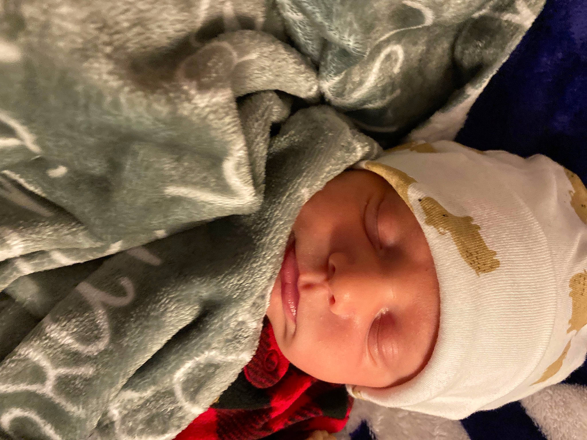 Branson is registered to the contest to win money with this photo: baby, baby_products, baby_toddler_clothing, bedtime, carmine, cheek, child, comfort, eye, face, happy, headwear, linens, lip, nap, nose, pattern, person, room, sleeve