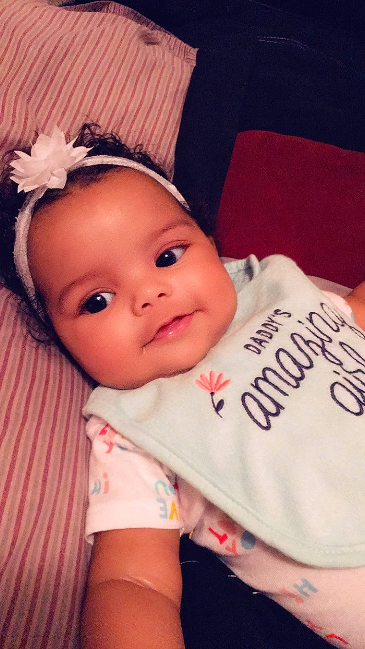 Avyanna is registered to the contest to win money with this photo: baby, baby_toddler_clothing, beauty, cheek, child, eye, face, fashion_accessory, forehead, hair_accessory, head, headband, headgear, iris, lip, nose, person, pink, product, skin