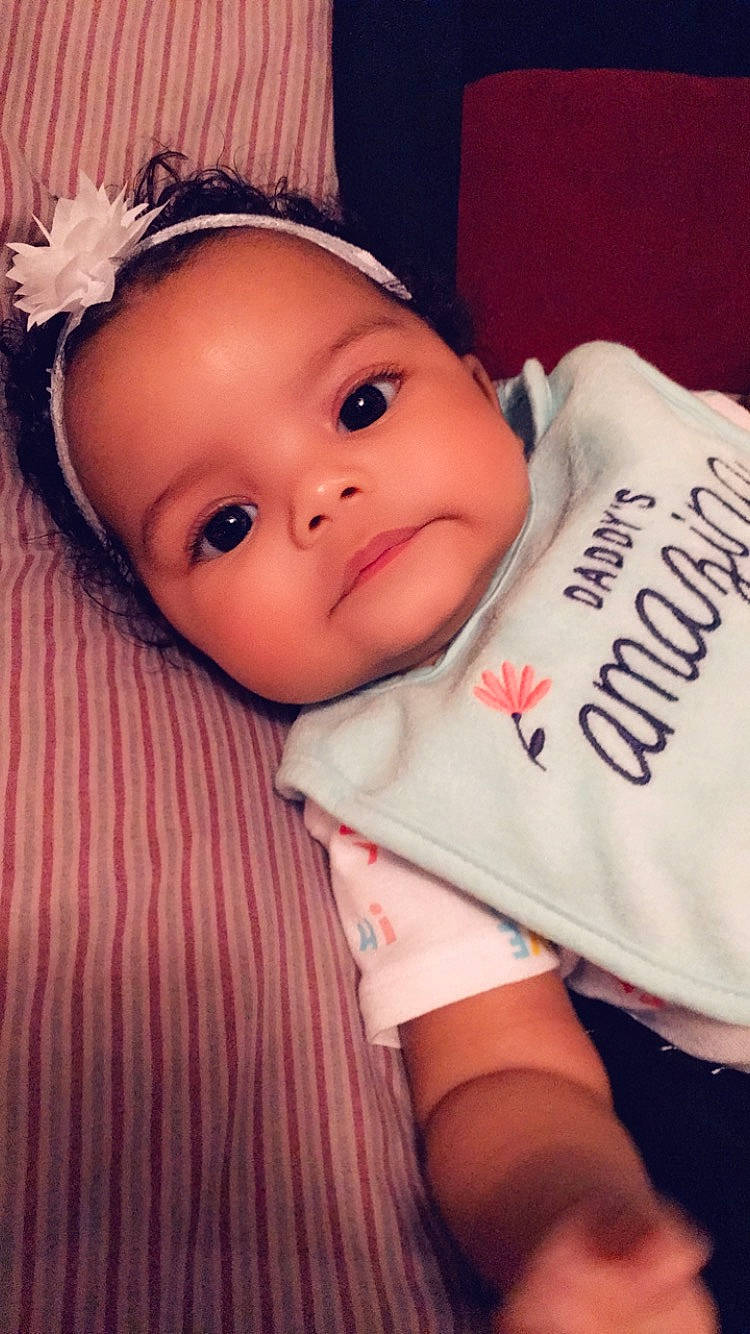 Avyanna is registered to the contest to win money with this photo: baby, beauty, cheek, child, cool, eye, eyebrow, face, forehead, hand, head, headgear, iris, lip, mouth, nose, person, pink, product, skin