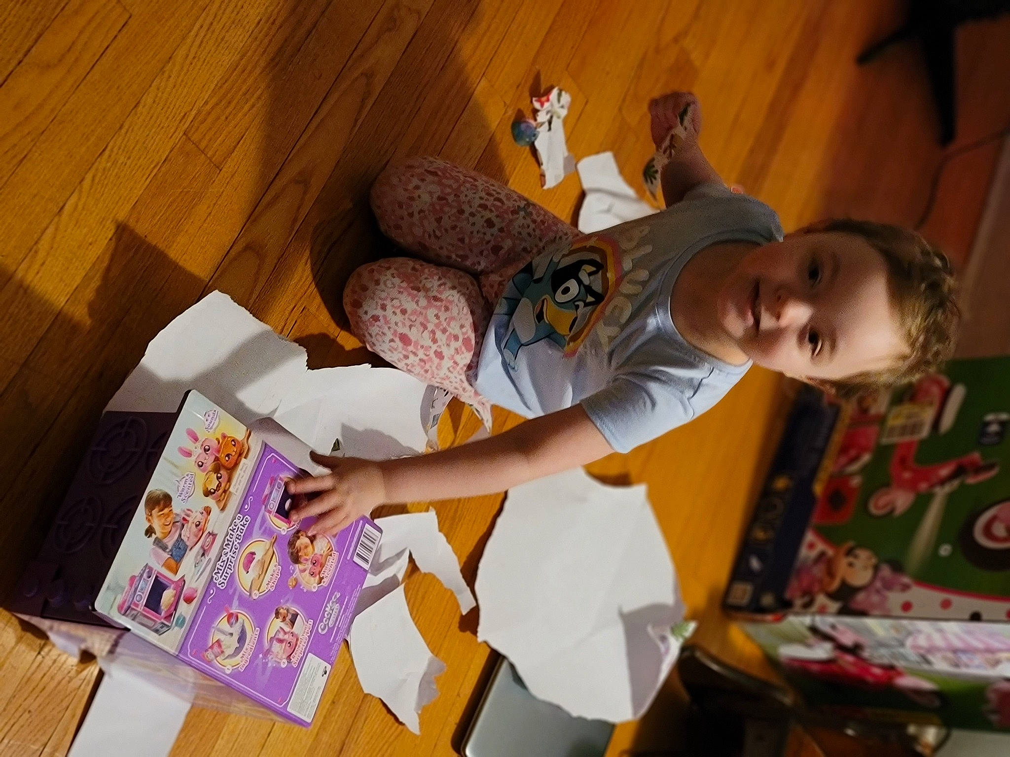 Hailey is registered to the contest to win money with this photo: baby, child, comfort, flooring, fun, happy, hardwood, hat, homework, joy, leisure, paper, paper_product, person, play, room, t_shirt, thigh, toddler, visual_arts