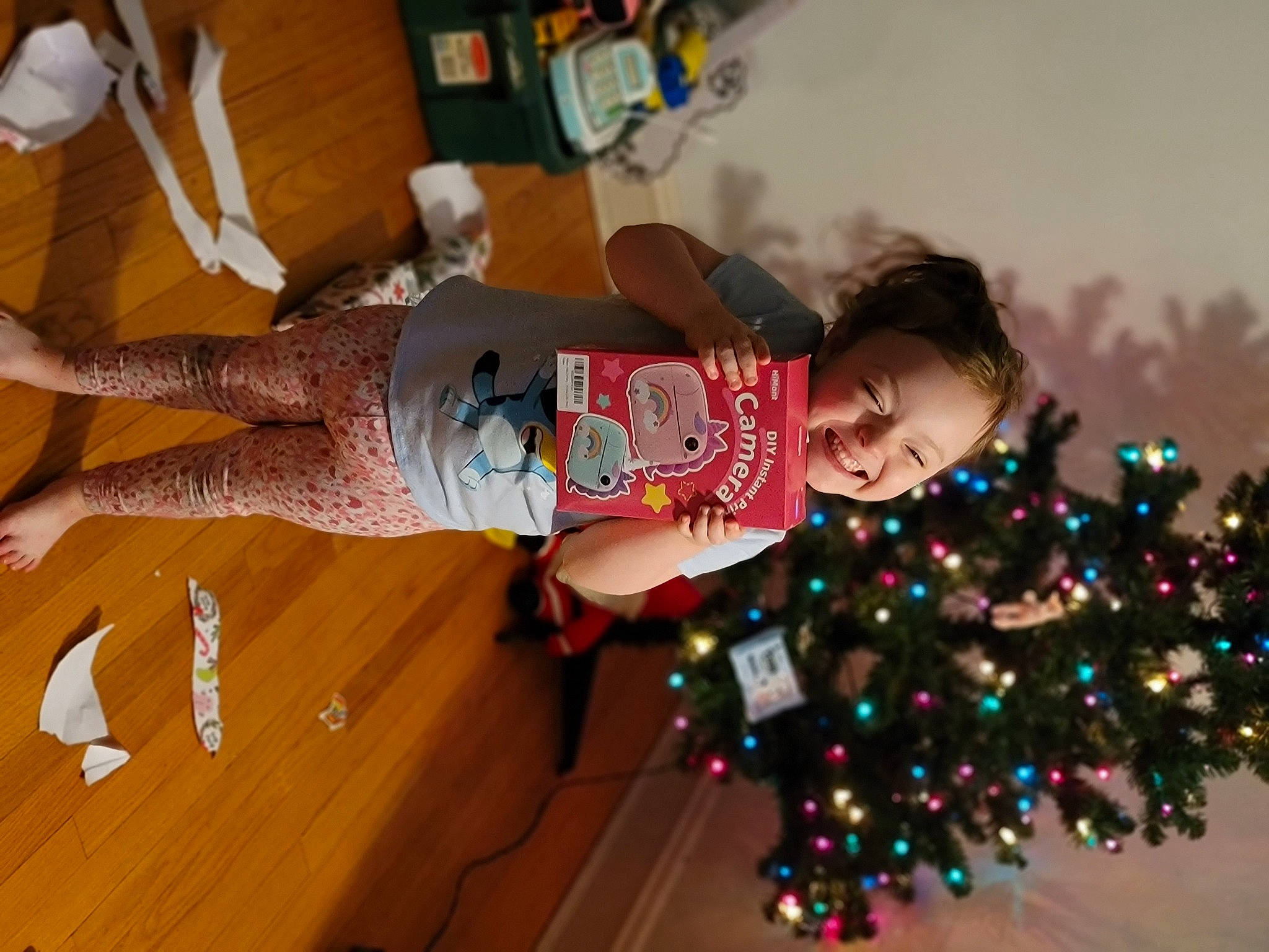 Hailey joined the competition — help win amazing prizes! child, christmas_decoration, christmas_ornament, christmas_tree, conifer, event, fun, happy, hardwood, holiday, human_leg, joy, knee, leisure, ornament, person, room, smile, thigh, toddler