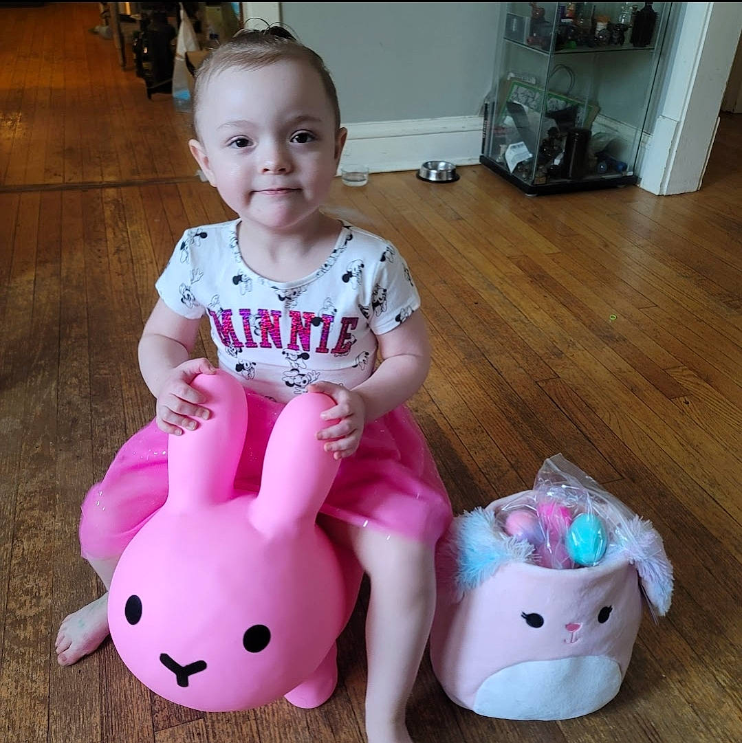 Hailey Jane is registered to the contest to win money with this photo: baby, baby_toddler_clothing, cheek, child, flooring, fun, happy, hardwood, joy, mammal, pattern, person, pink, product, sitting, skin, sleeve, smile, t_shirt, toddler