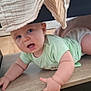 baby, candid, child, cloth, crawling, curious, cute, expression, face, floor, furniture, green_onesie, hand, home, indoors, infant, legs, person, wood_floor, young