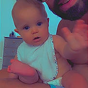 Bryana participe au concours pour gagner de l'argent avec cette photo : adult, baby, beard, bib, child, curious, dresser, face, family, foot, furniture, glasses, hand, indoor, person, photograph, portrait, shorts, skin, smile