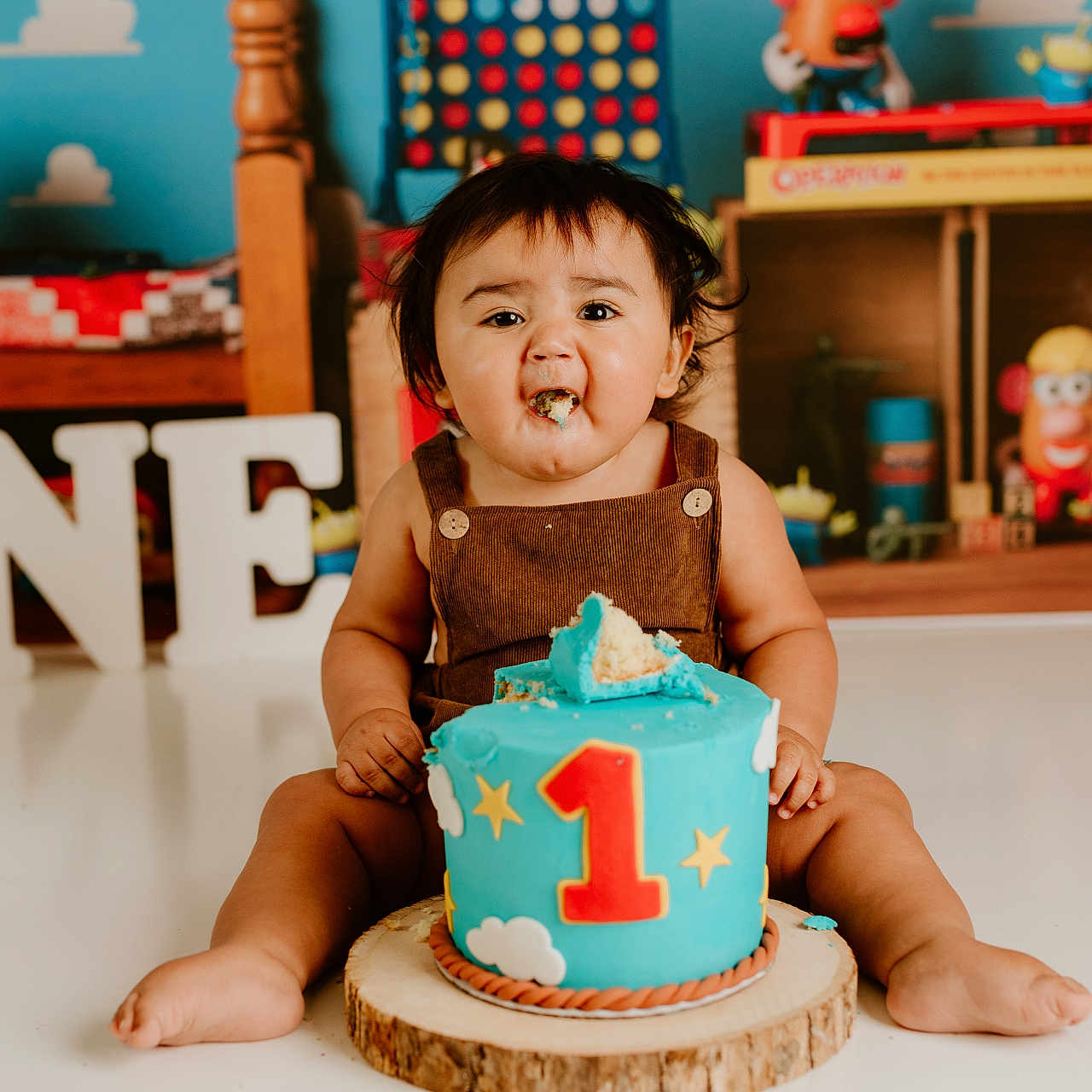 Joaquin is registered to the contest to win money with this photo: baby, birthdaycake, birthdayparty, cake, cream, dessert, face, food, fun, furniture, happy, head, icing, party, people, person, photography, portrait, sitting, smile