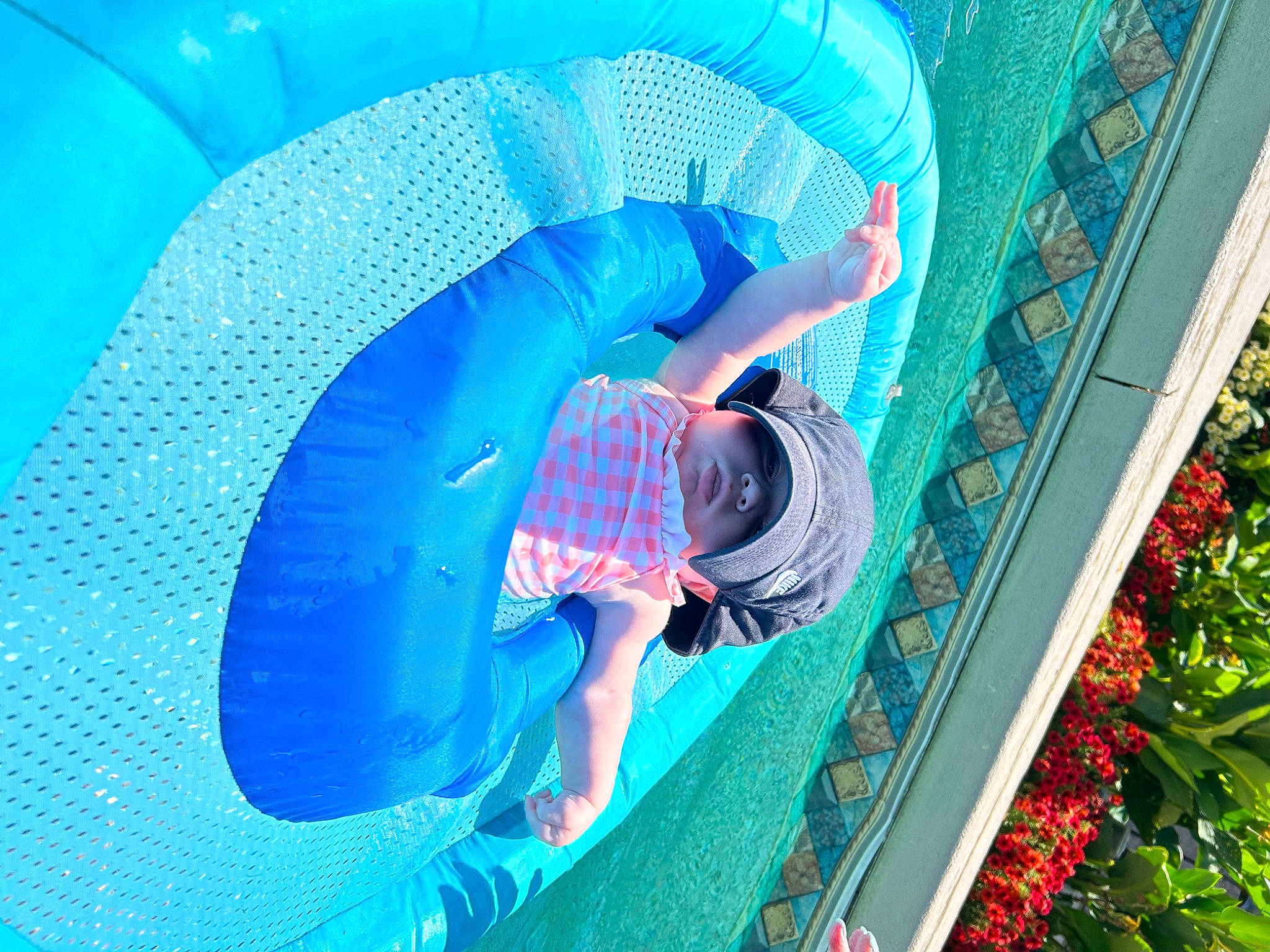 Karter is registered to the contest to win money with this photo: aqua, azure, baby, blue, child, chute, circle, city, comfort, electric_blue, fun, happy, headwear, leisure, magenta, outdoor_play_equipment, person, plant, playground, recreation