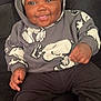 Legend joined the competition — help win amazing prizes! baby, child, hoodie, smile, tongue, sitting, cozy, clothing, black_pants, white_socks, couch, indoor, cute, happy, infant, face, headwear, casual, comfort, young
