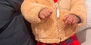 Legend joined the competition — help win amazing prizes! baby, child, hoodie, teddy_bear, plaid_pants, red_pants, couch, indoor, cozy, warm_clothing, socks, cute, infant, relaxed, portrait, person, face, hands, seated, blanket