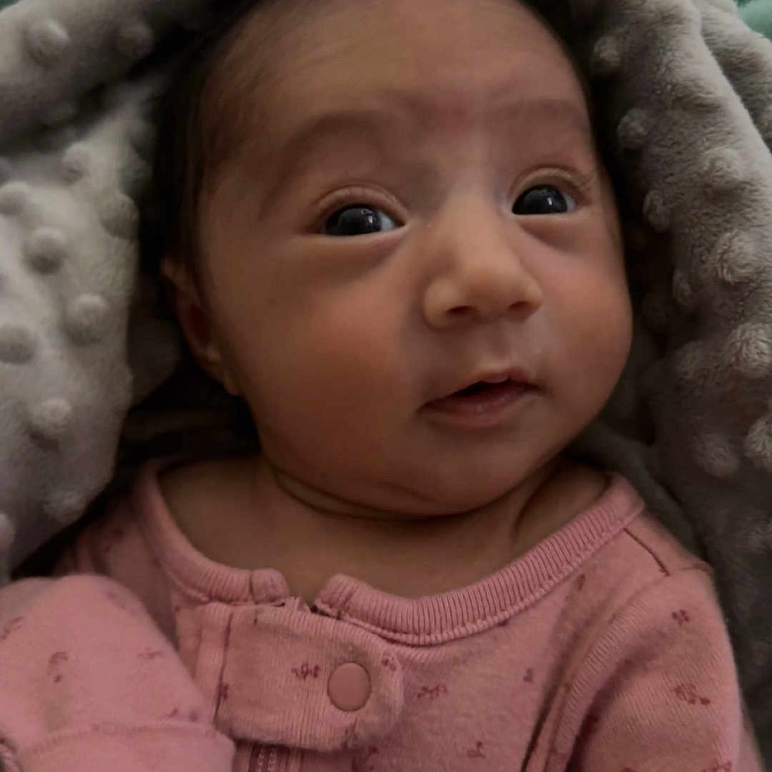 Soleia joined the competition — help win amazing prizes! baby, blanket, bonnet, cap, clothing, face, happy, hat, head, hood, hoodie, knitwear, newborn, person, photography, portrait, quilt, smile, sweater, sweatshirt