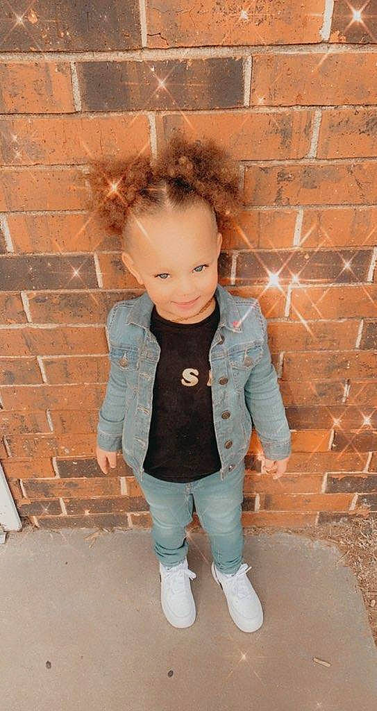 Promise is registered to the contest to win money with this photo: arm, baby_toddler_clothing, bangs, blazer, brick, brickwork, clothing, dress, face, formal_wear, happy, jacket, joy, leg, lip, neck, outerwear, person, sleeve, smile