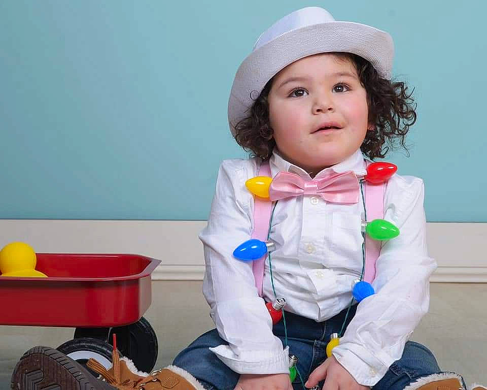 Mordecai is registered to the contest to win money with this photo: baby_toddler_clothing, cap, child, costume_hat, electric_blue, eye, fashion_accessory, fun, gesture, happy, hat, head, headgear, headwear, leisure, person, play, sitting, sleeve, smile