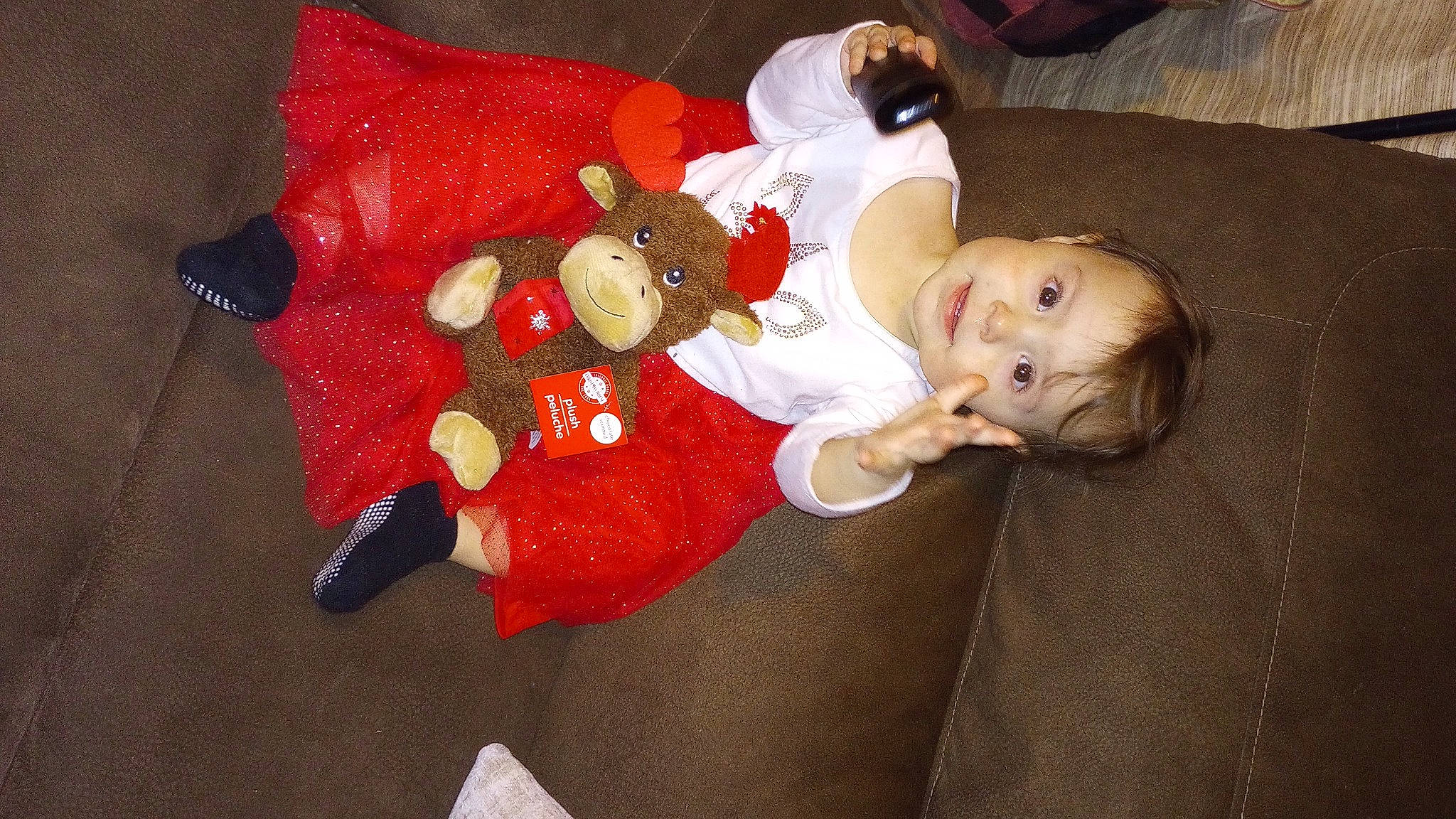 Aubrey joined the competition — help win amazing prizes! baby, baby_toddler_clothing, carmine, child, christmas, christmas_decoration, christmas_eve, comfort, event, fictional_character, holiday, human_body, lap, person, room, sitting, smile, toddler, wood