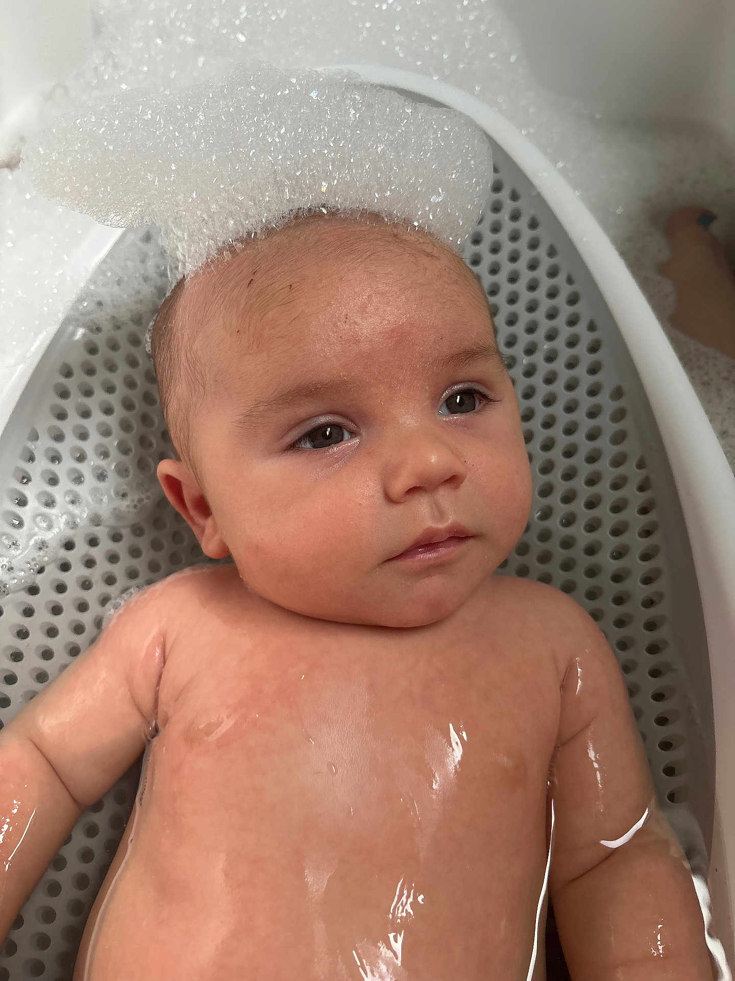 Jaxson is registered to the contest to win money with this photo: baby, bath, bubbles, foam, water, skin, head, face, arm, child, tub, infant, relaxation, wet, cute, young, closeup, indoors, portrait, playful