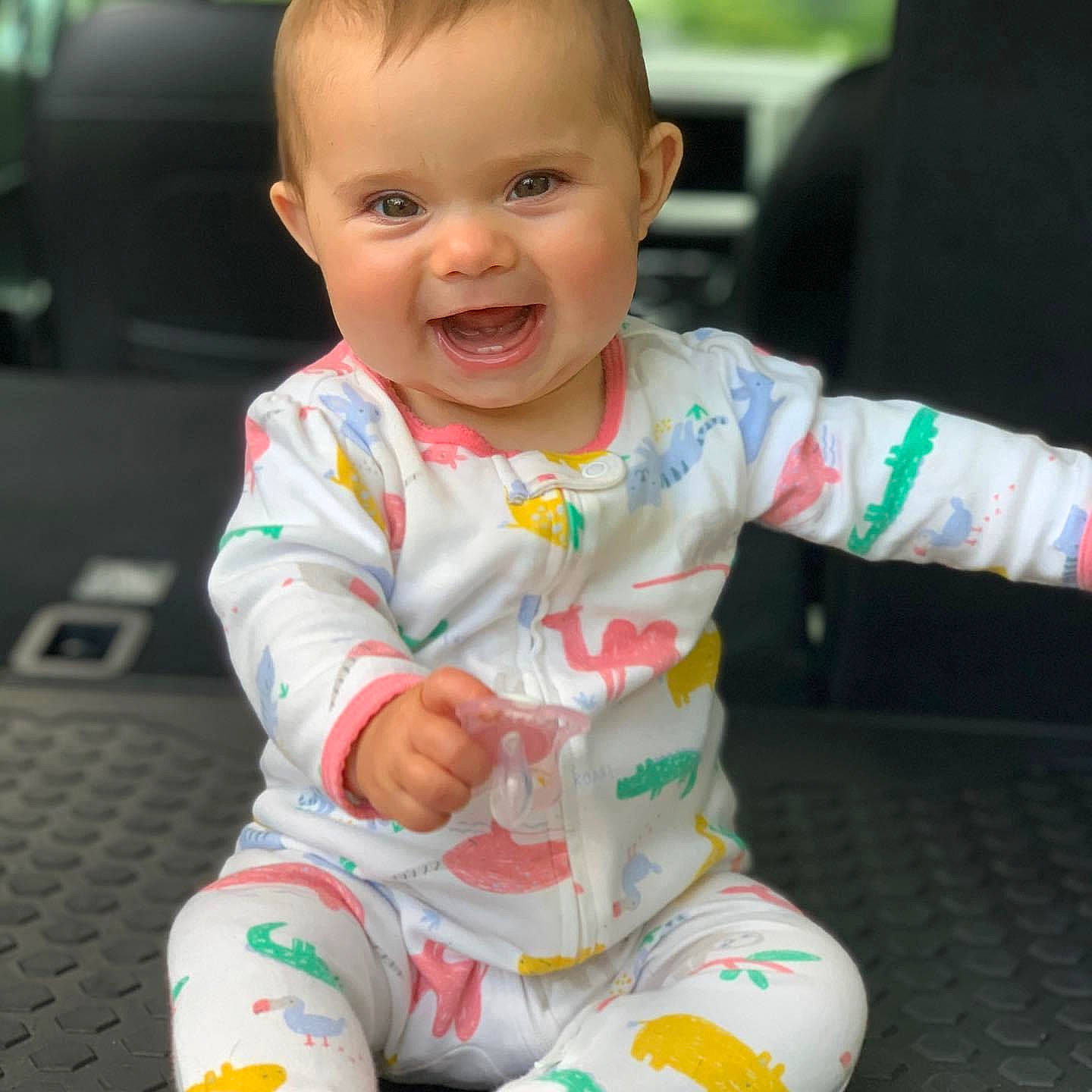 Madelyn joined the competition — help win amazing prizes! baby, baby_toddler_clothing, beauty, cheek, child, face, head, person, play, sitting, skin, sleeve, smile, toddler, vehicle