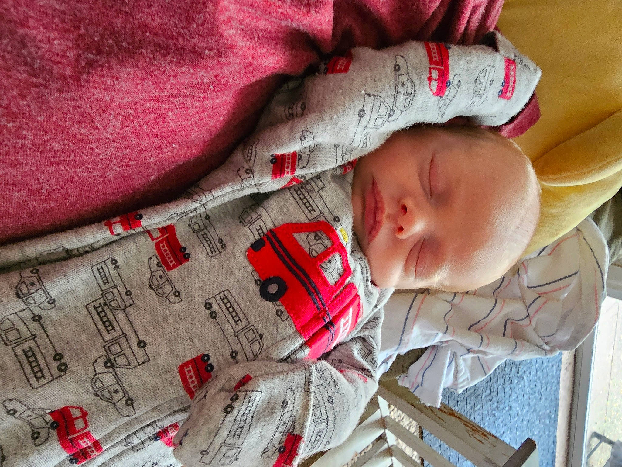 Atreus is registered to the contest to win money with this photo: baby, baby_toddler_clothing, cheek, close_up, comfort, eye, eyelash, facial_expression, font, hand, linens, lip, pattern, person, red, skin, sleeve, textile, toddler, white