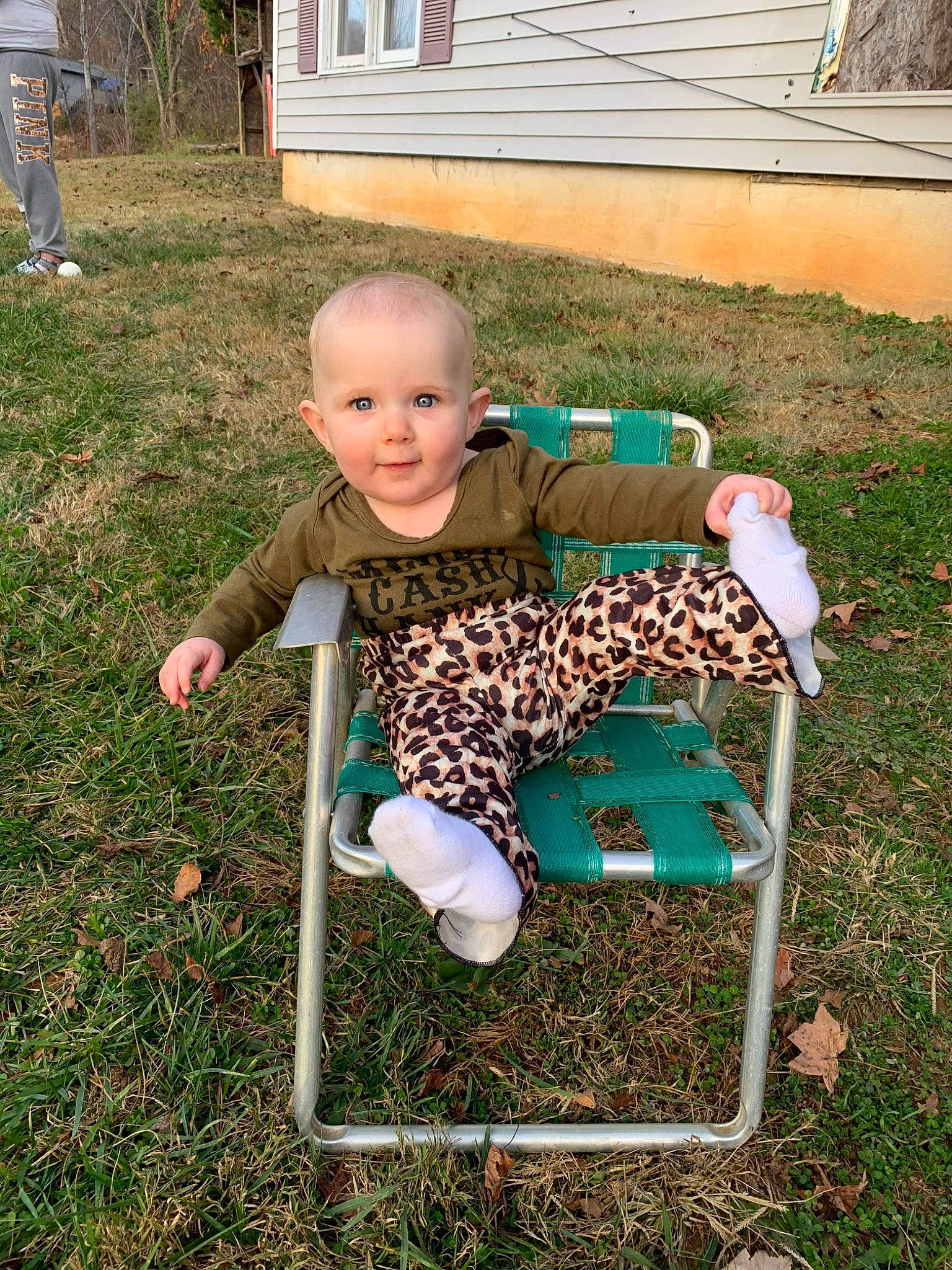 Ellamae is registered to the contest to win money with this photo: baby, baby_toddler_clothing, chair, child, folding_chair, fun, garden, grass, grass_family, lawn, leisure, outdoor_furniture, people_in_nature, person, plant, recreation, sitting, smile, soil, toddler