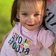 Sofia participe au concours pour gagner de l'argent avec cette photo : child, girl, smile, face, hair, pink_shirt, flower, outdoor, green_background, portrait, sunlight, happy, cute, person, toddler, playful, closeup, casual_clothing, nature, summer