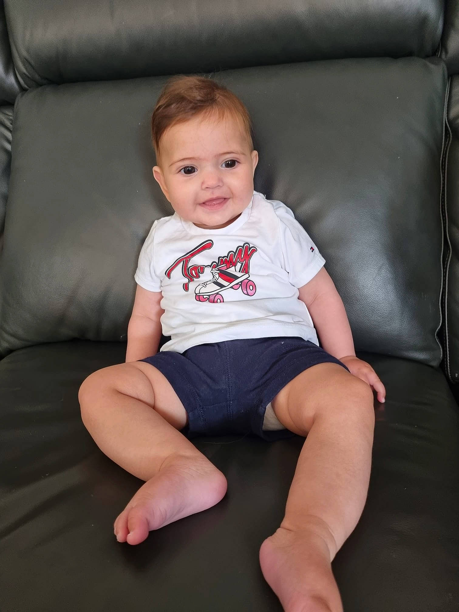 Lila joined the competition — help win amazing prizes! baby_toddler_clothing, cheek, comfort, couch, elbow, eye, face, finger, flash_photography, hair, head, iris, joy, knee, neck, person, shorts, skin, sleeve, t_shirt