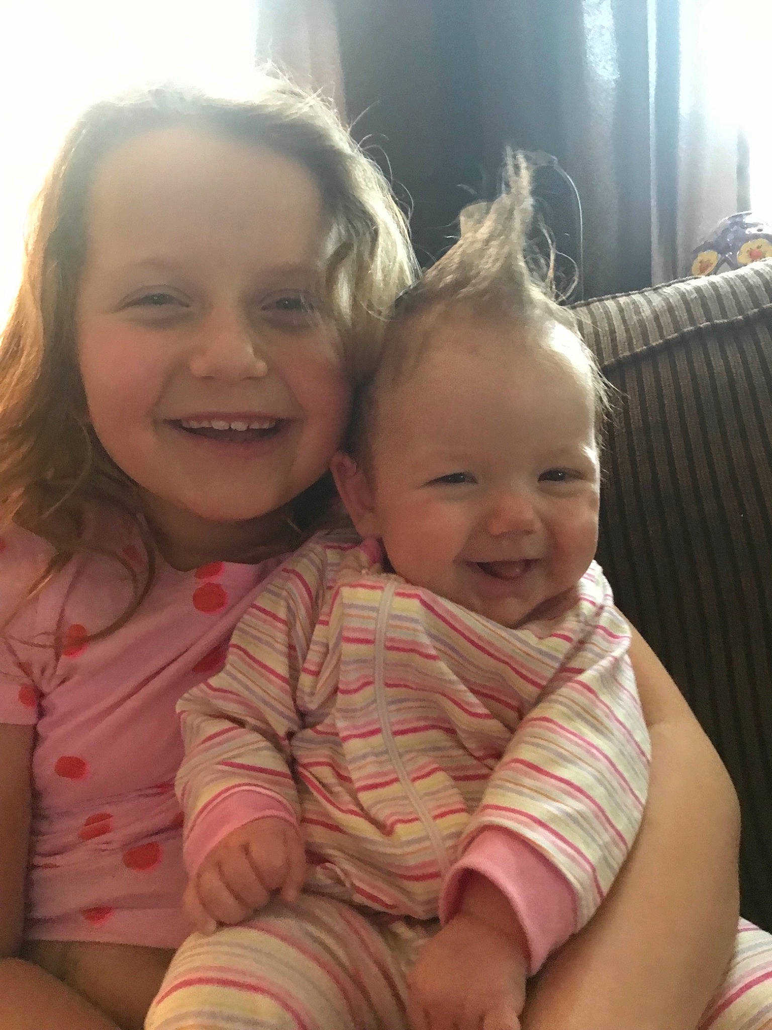 Natalee is registered to the contest to win money with this photo: baby, cheek, child, daughter, face, facial_expression, fun, happy, head, hug, interaction, joy, laugh, mother, nose, people, person, sibling, sitting, skin