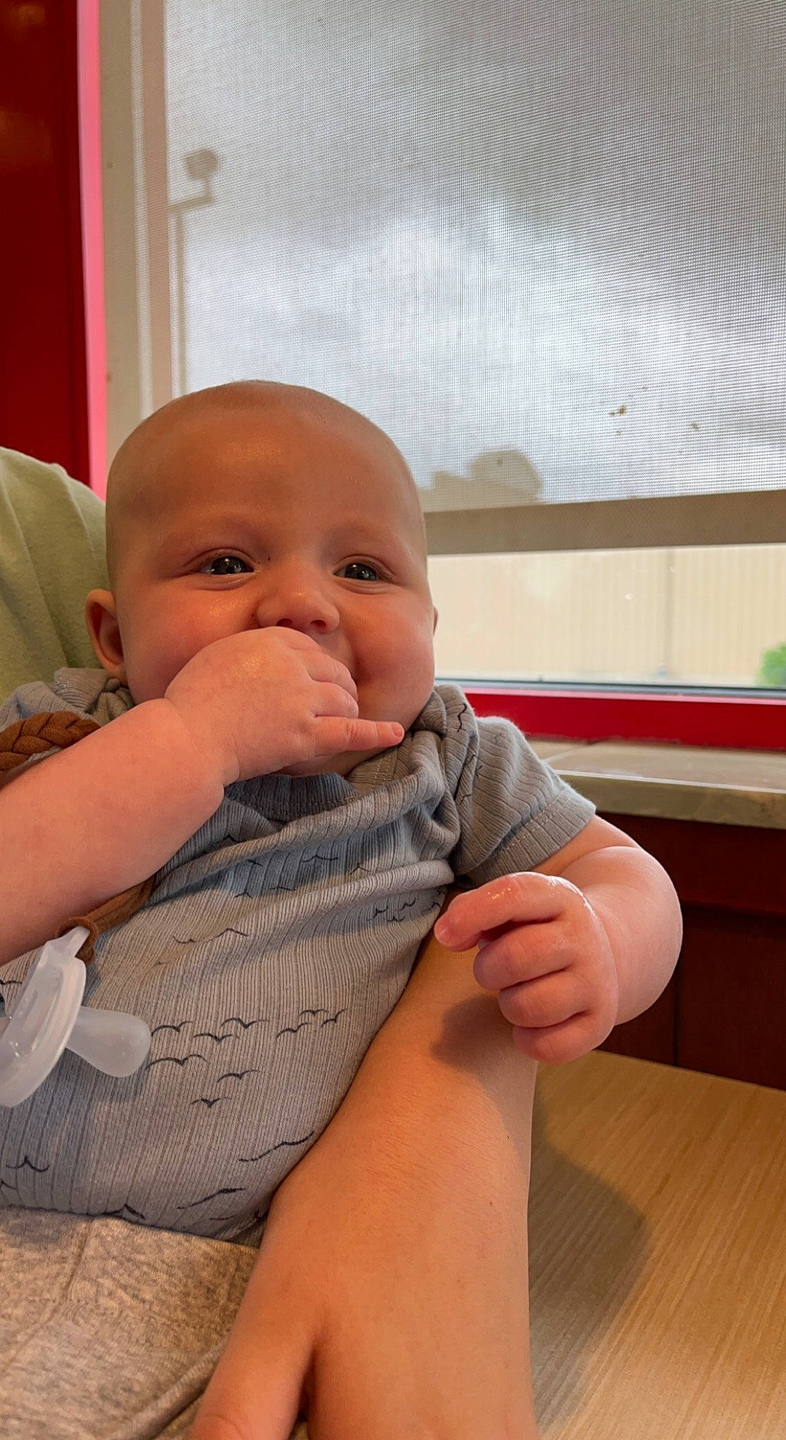 Easton is registered to the contest to win money with this photo: abdomen, baby, baby_toddler_clothing, cheek, chin, comfort, elbow, eye, flooring, gesture, human_body, nail, neck, nose, person, sitting, skin, sleeve, thumb, toddler