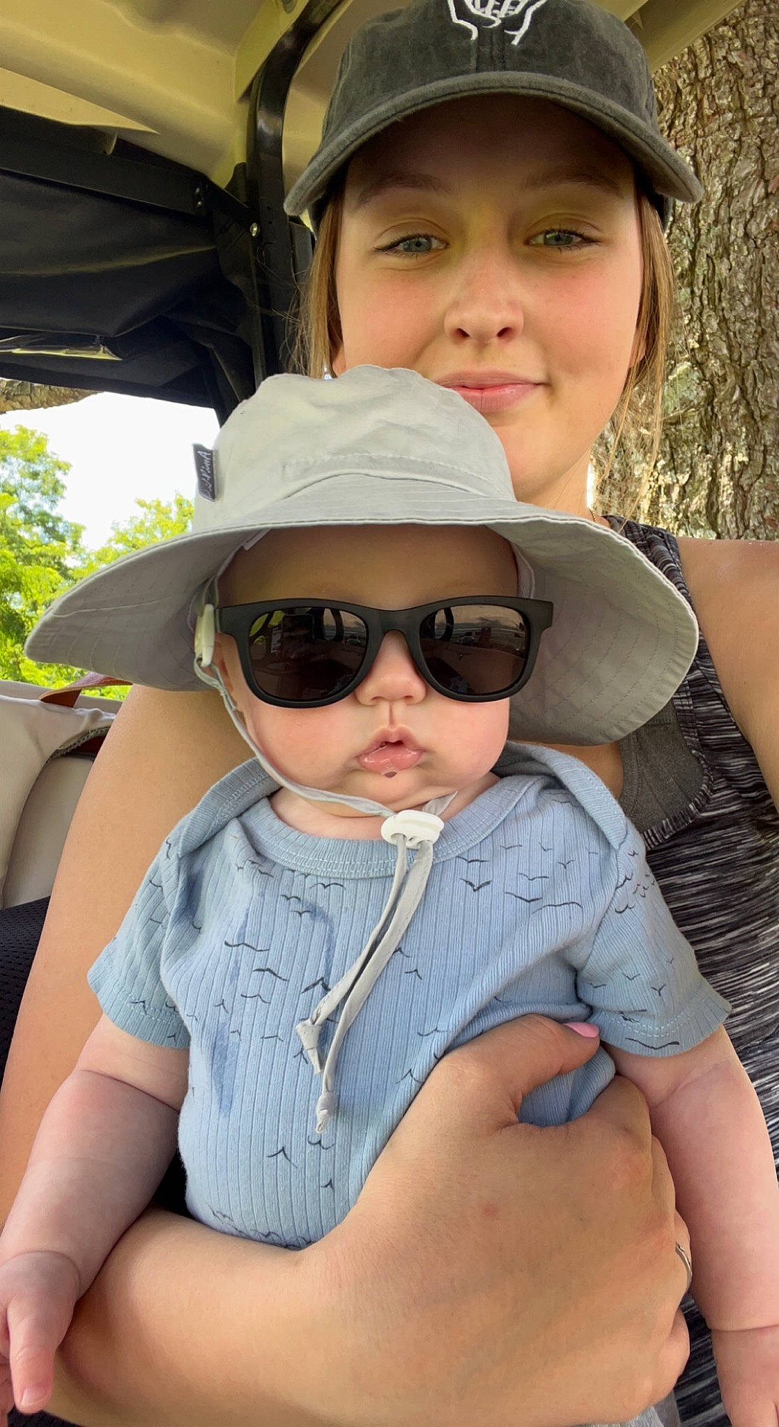 Easton is registered to the contest to win money with this photo: cap, chin, eye, eyewear, face, facial_expression, glasses, goggles, hairstyle, happy, hat, head, headwear, interaction, joy, lip, person, skin, smile, sun_hat