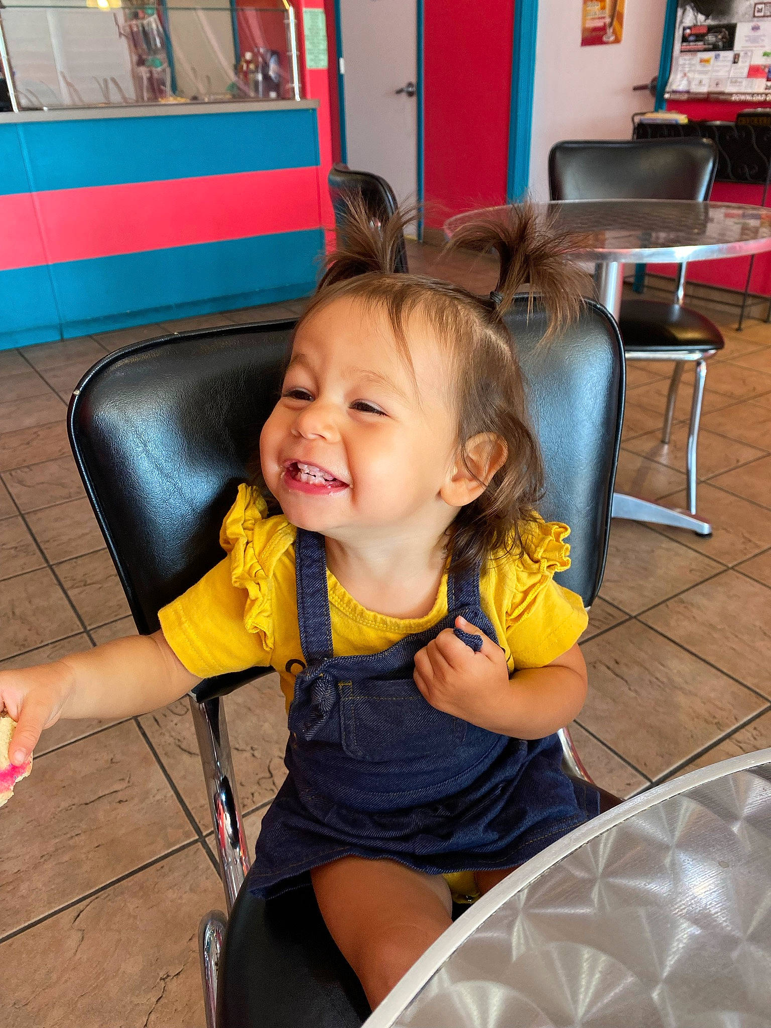 Blair joined the competition — help win amazing prizes! automotive_wheel_system, baby_toddler_clothing, chair, child, finger, fun, furniture, hairstyle, happy, joy, lap, leisure, person, room, shelf, sitting, skin, smile, thigh, thumb