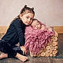 Kim participe au concours pour gagner de l'argent avec cette photo : child, baby, newborn, girl, sleeping, blanket, wood_floor, wooden_box, pink, black_clothing, long_hair, barefoot, indoors, portrait, candid, floor, cozy, resting, sibling, family