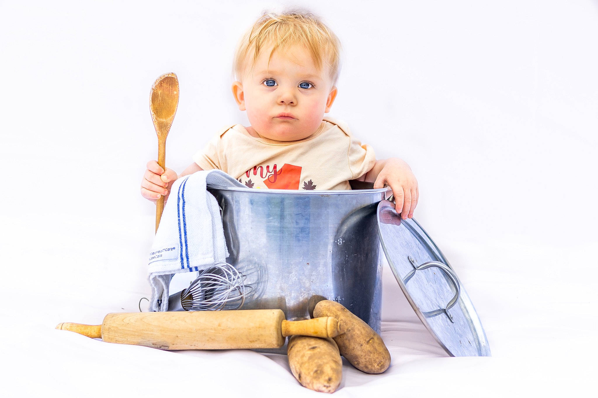 Nikolas is registered to the contest to win money with this photo: arm, baby, baby_products, baby_toddler_clothing, comfort, electric_blue, finger, fun, gesture, hand, happy, human_body, knee, leisure, person, product, sitting, sleeve, t_shirt, toddler