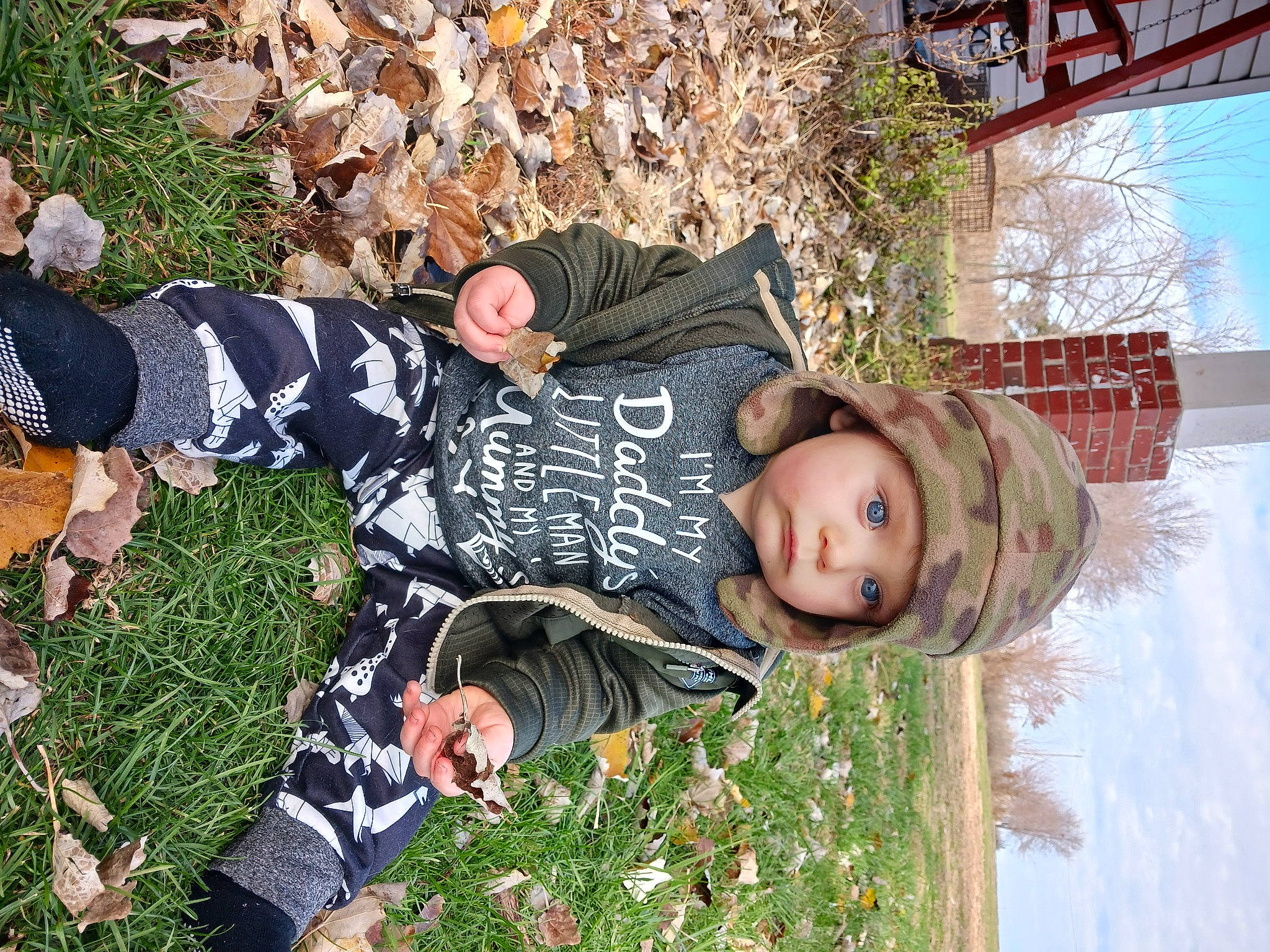 Nikolas joined the competition — help win amazing prizes! flower, fun, grass, happy, hat, headwear, leaf, leisure, pattern, people_in_nature, person, plant, sitting, spring, toddler, tree