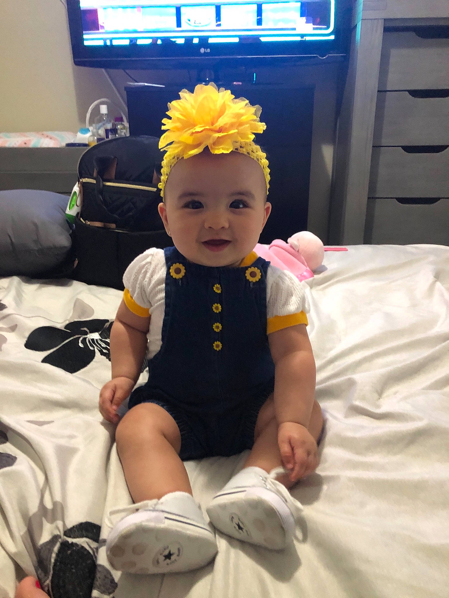 Anabelle joined the competition — help win amazing prizes! baby, child, costume, ear, headband, headgear, leg, person, room, smile, sportswear, t_shirt, toddler, vacation, yellow