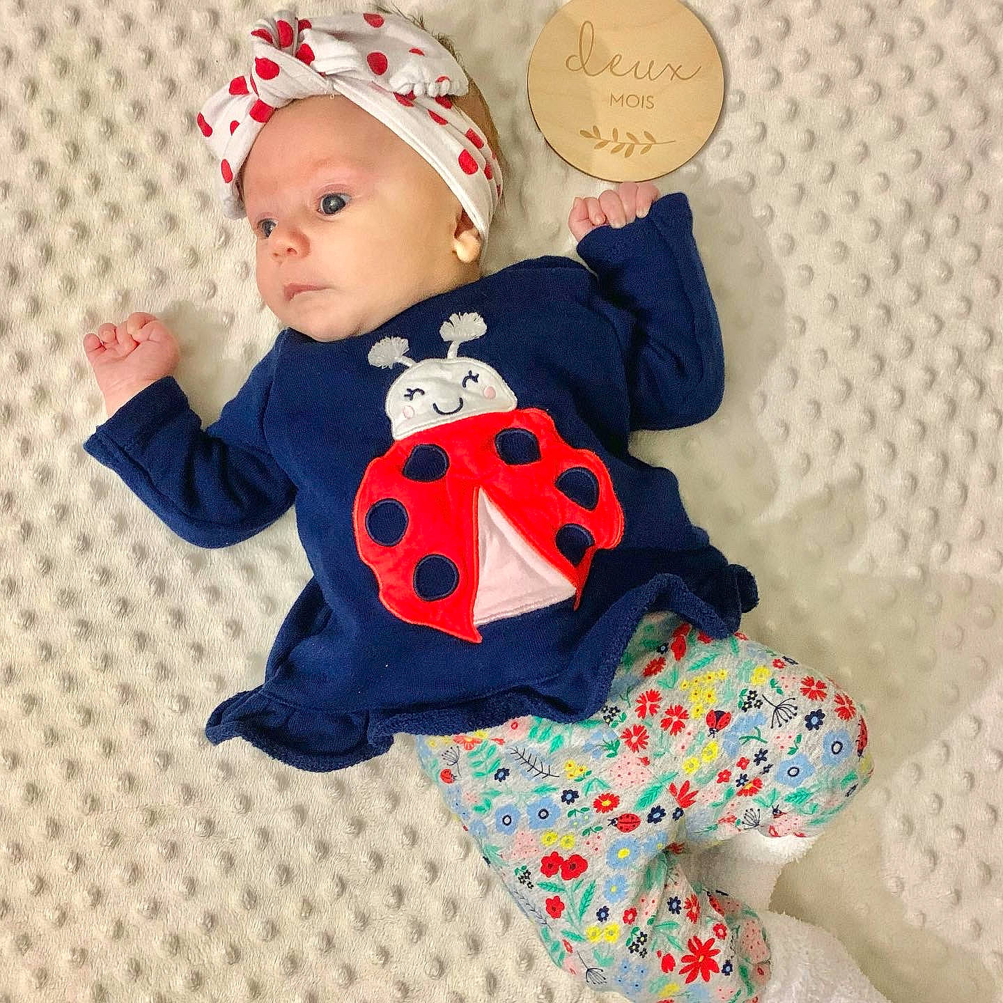 Romie participe au concours pour gagner de l'argent avec cette photo : arm, baby, baby_products, baby_toddler_clothing, child, doll, facial_expression, font, happy, headgear, headwear, mammal, pattern, person, pink, plush, sleeve, stuffed_toy, textile, toddler