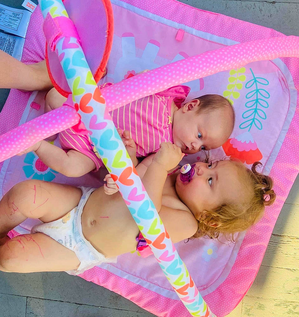 Carmella joined the competition — help win amazing prizes! baby_toddler_clothing, chest, child, comfort, finger, fun, happy, human_body, leg, leisure, magenta, person, photograph, pink, skin, snapshot, swimwear, textile, thigh, toddler