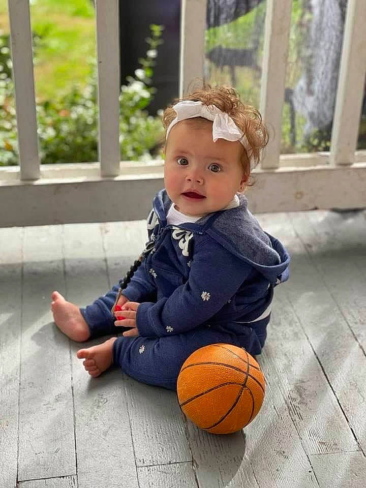 Camilla is registered to the contest to win money with this photo: baby, baby_toddler_clothing, ball, ball_game, basketball, child, eye, flooring, football, fun, grass, happy, people_in_nature, person, plant, portrait_photography, pumpkin, sitting, sports_equipment, toddler