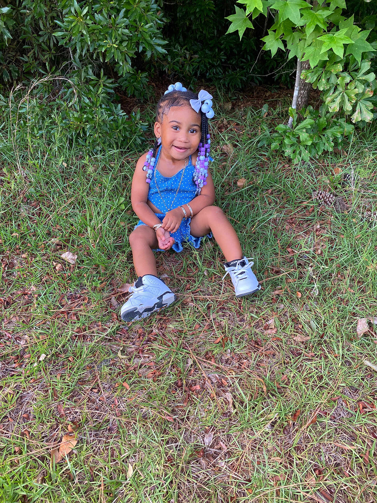 Emiracle joined the competition — help win amazing prizes! backyard, child, clothing, face, female, footwear, girl, grass, head, leaf, nature, outdoors, person, photography, plant, portrait, shoe, sitting, soil, yard