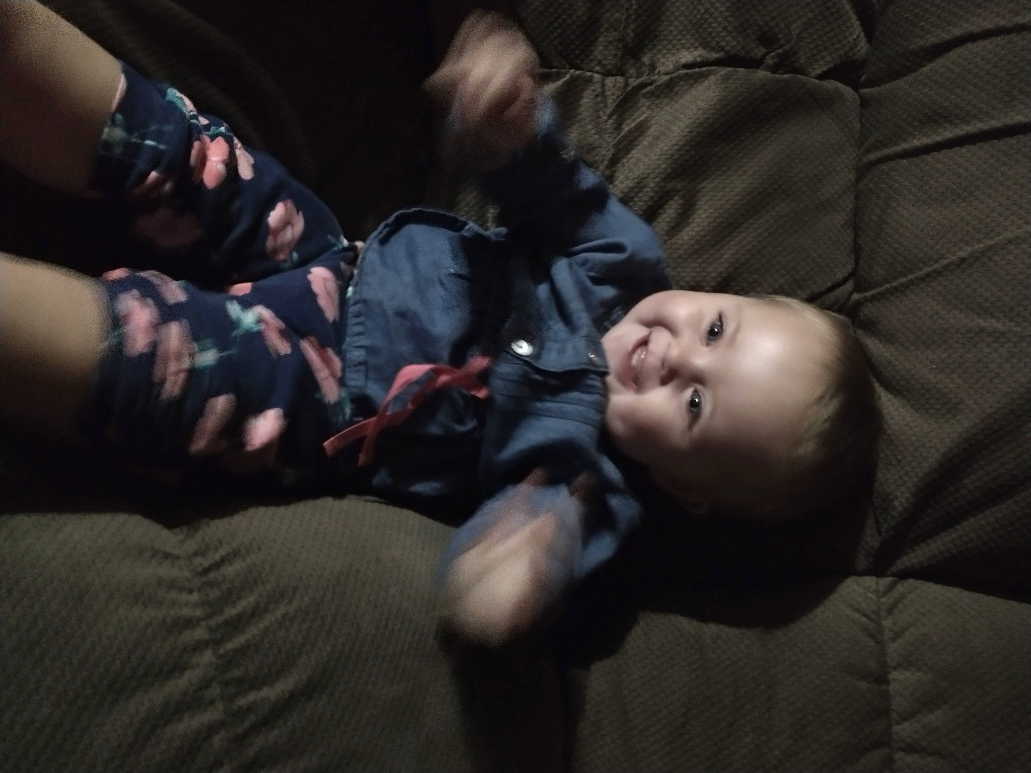 Molly is registered to the contest to win money with this photo: baby, child, cloud, comfort, darkness, elbow, flash_photography, fun, gesture, human_leg, joy, mouth, night, person, room, sitting, smile, thumb, toddler, tree