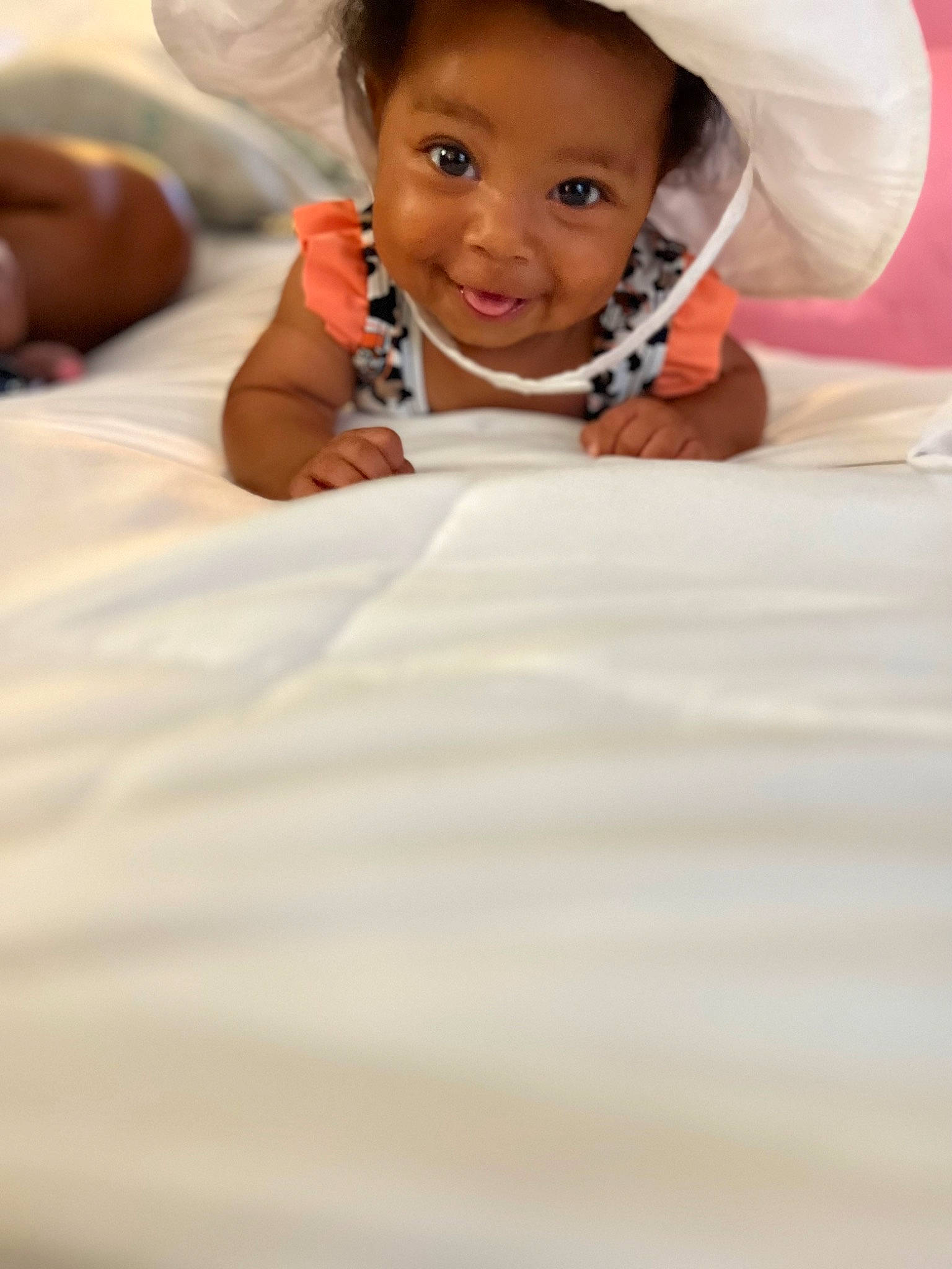 Kolbee is registered to the contest to win money with this photo: baby, child, comfort, eyebrow, finger, flash_photography, flooring, fun, gesture, hair, happy, head, joy, linens, mouth, nose, person, skin, smile, thumb