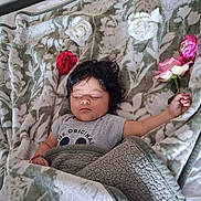 Kim joined the competition — help win amazing prizes! baby, bed, blanket, bouquet, child, cozy, dark_hair, face, floral, flower, gray_shirt, home, indoors, infant, lying_down, nap, peaceful, portrait, roses, sleeping