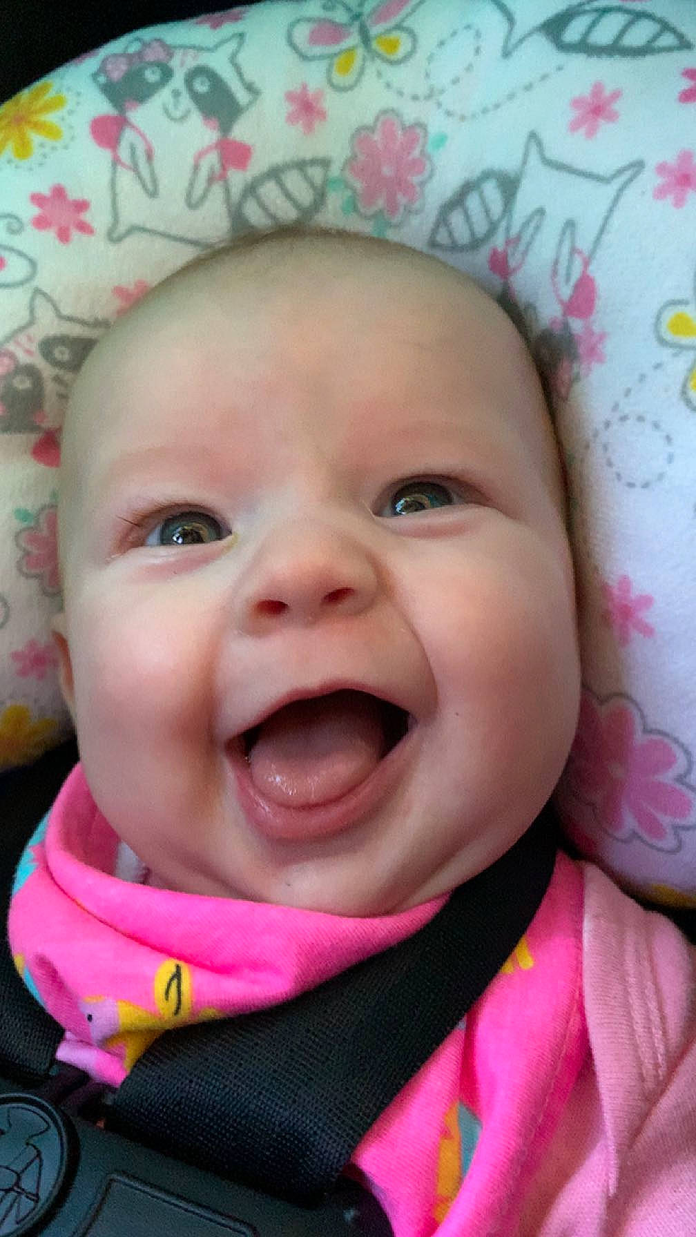 Sadie is registered to the contest to win money with this photo: baby, cheek, chin, eye, eyebrow, eyelash, face, facial_expression, happy, head, iris, lip, mouth, nose, person, pink, product, skin, smile, toddler