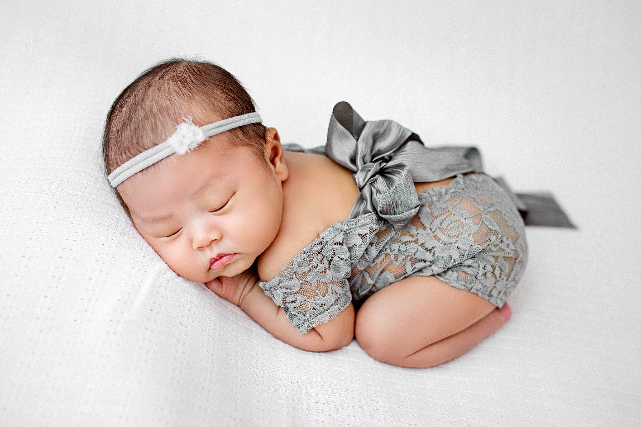 Dream is registered to the contest to win money with this photo: arm, baby, baby_products, baby_sleeping, baby_toddler_clothing, cap, child, comfort, fashion_accessory, flash_photography, foot, grass, happy, headband, headgear, headpiece, human_leg, pattern, person, sitting