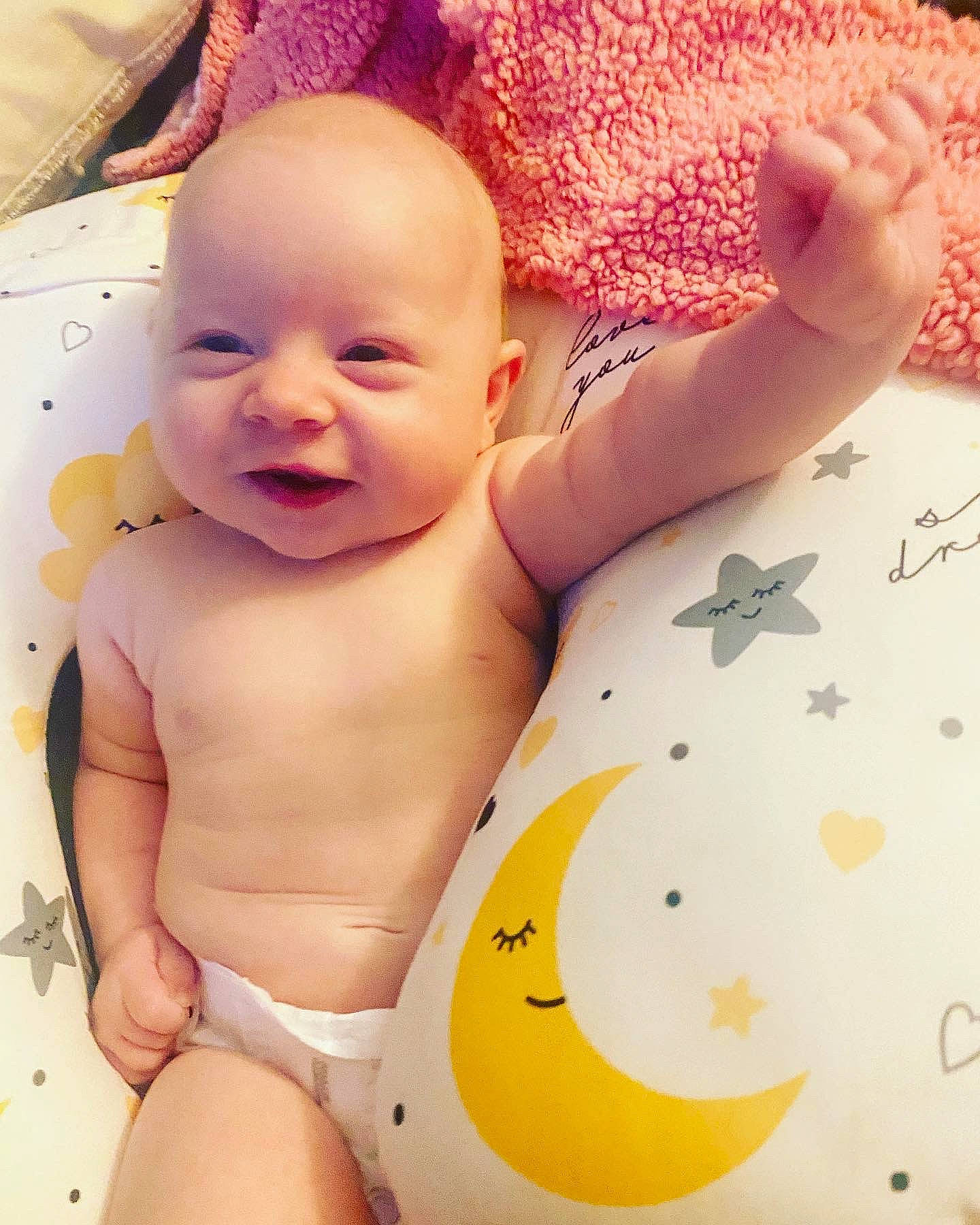 Kaycee joined the competition — help win amazing prizes! arm, baby, baby_toddler_clothing, comfort, face, hand, happy, human, human_body, joint, mouth, muscle, neck, person, pink, skin, sleeve, smile, stomach, textile