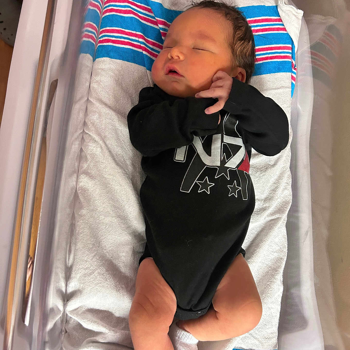 Shepard is registered to the contest to win money with this photo: architecture, baby, bed, blanket, bodypart, building, cradle, crib, cushion, face, furniture, head, homedecor, hospital, infantbed, newborn, person, photography, portrait, sleeping
