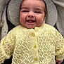 Rohan joined the competition — help win amazing prizes! baby, smiling, yellow_sweater, knitted_clothing, infant, cushion, blanket, soft_texture, happy, face, portrait, lying_down, cozy, indoor, child, cute, buttoned_sweater, warm, comfort, newborn