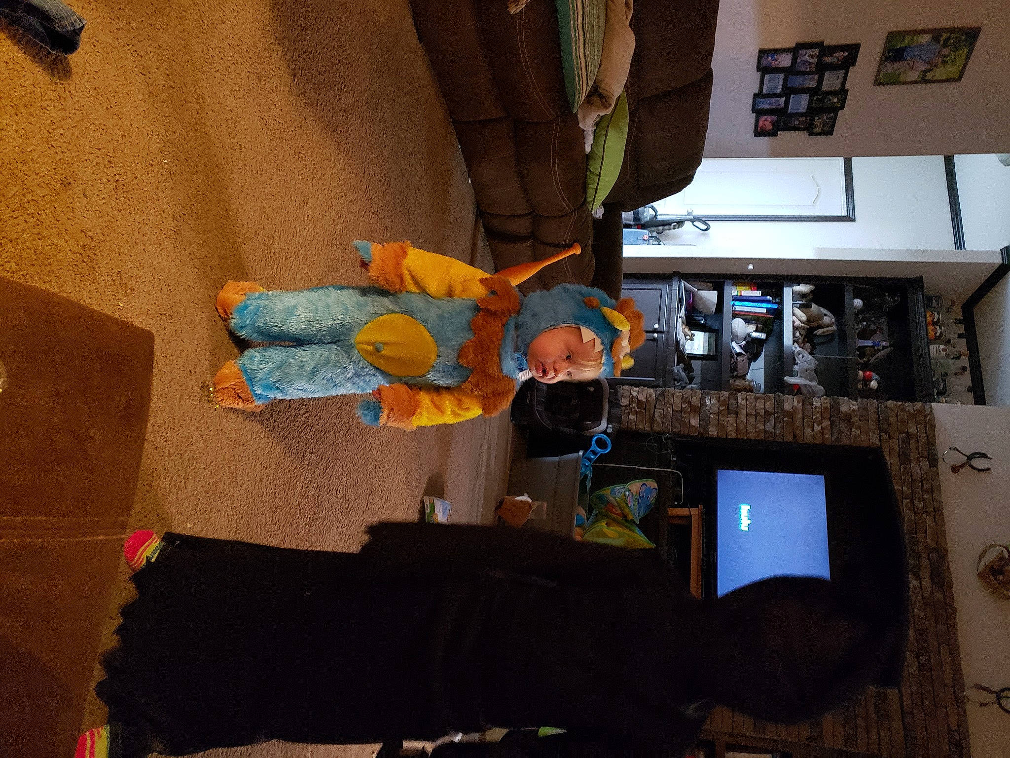 Johnathan is registered to the contest to win money with this photo: art, ceiling, display_device, fun, headwear, house, machine, person, recreation, room, space, t_shirt, visual_arts, wood